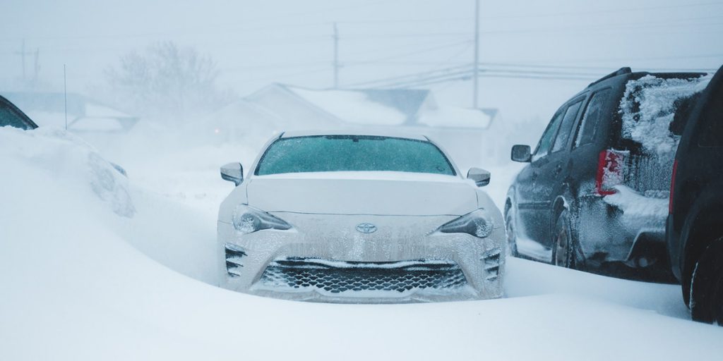 Car being snowed in.